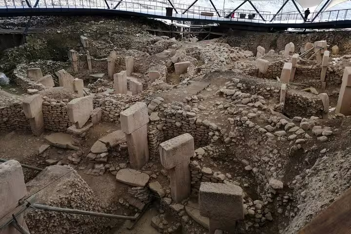Gobeklitepe excavation site with T-shaped pillars under shelter, key highlight on 10-day private Turkey tour