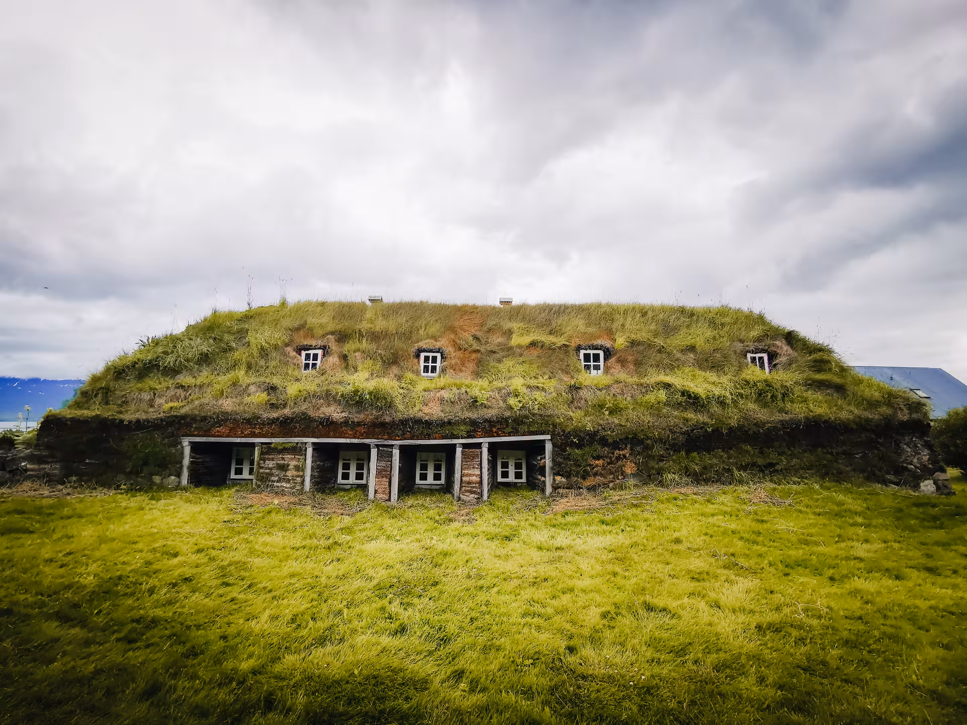 Traditional turf-roof farmhouse at Laufás Museum on a private Goðafoss and Forest Lagoon day tour