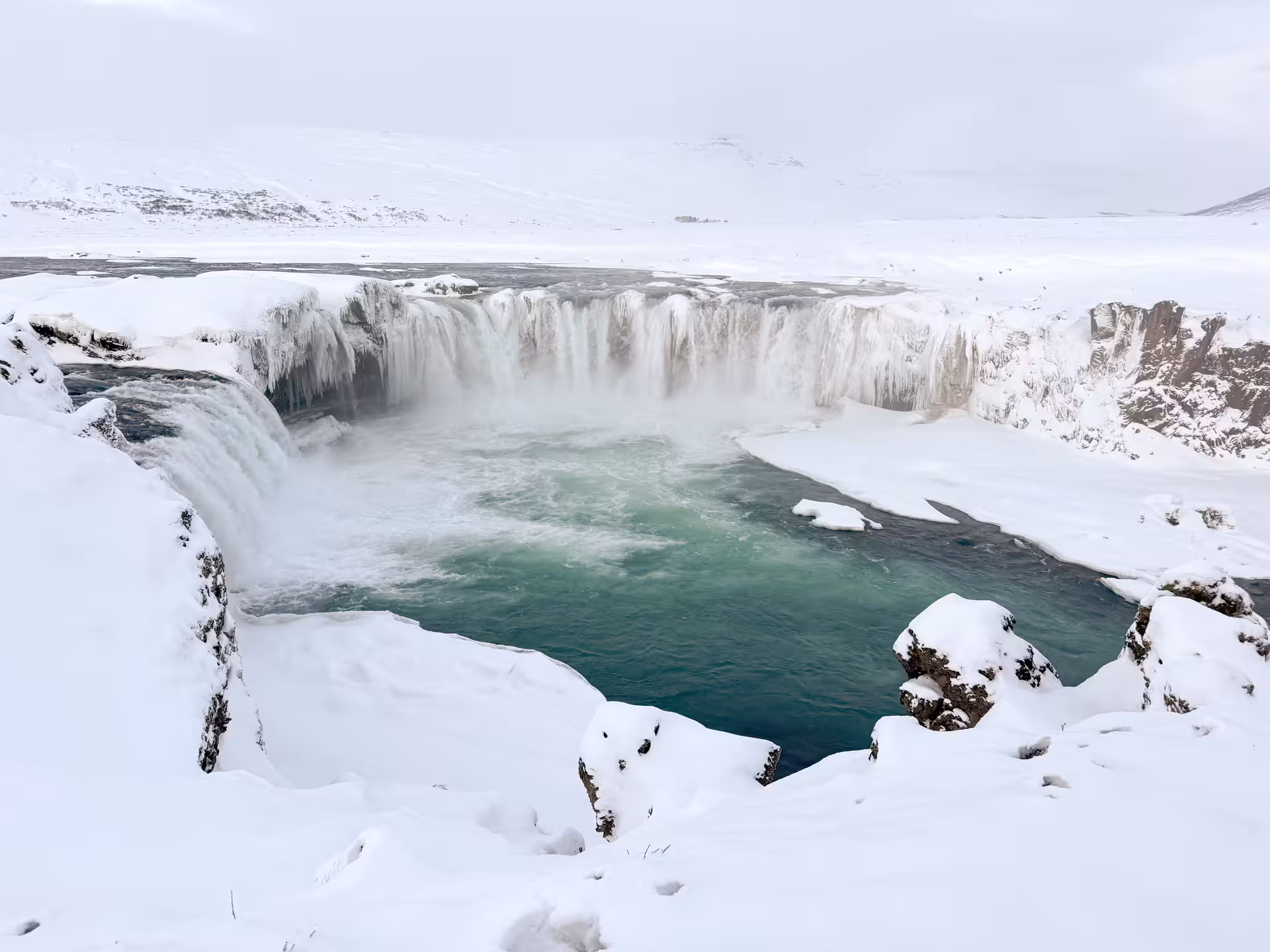 Snowy Goðafoss Waterfall viewpoint in North Iceland, a highlight of the private Northern Wonders day tour