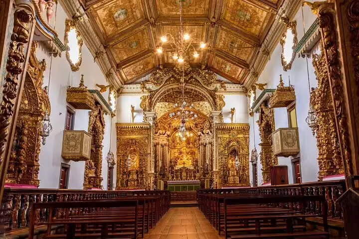 Intricately decorated gold altar inside a historic church on the Gold Route in Minas Gerais.