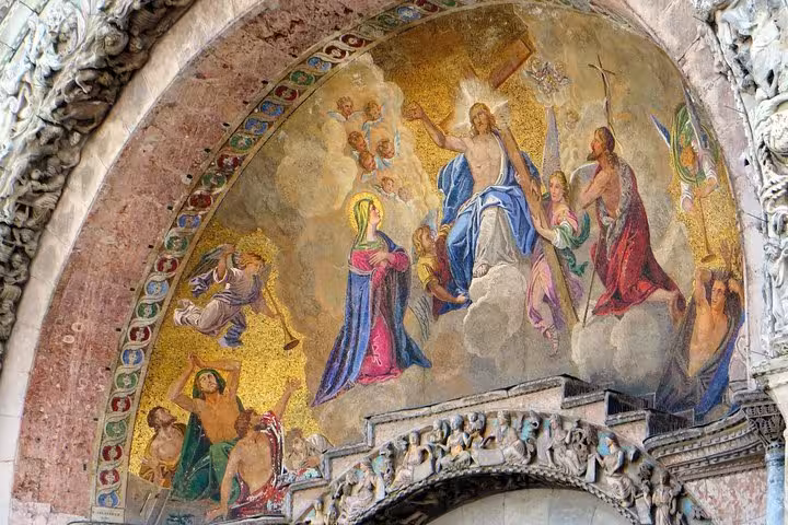 Vivid religious mosaic on The Golden Basilica's arch, depicting divine figures in rich colors and intricate detail.