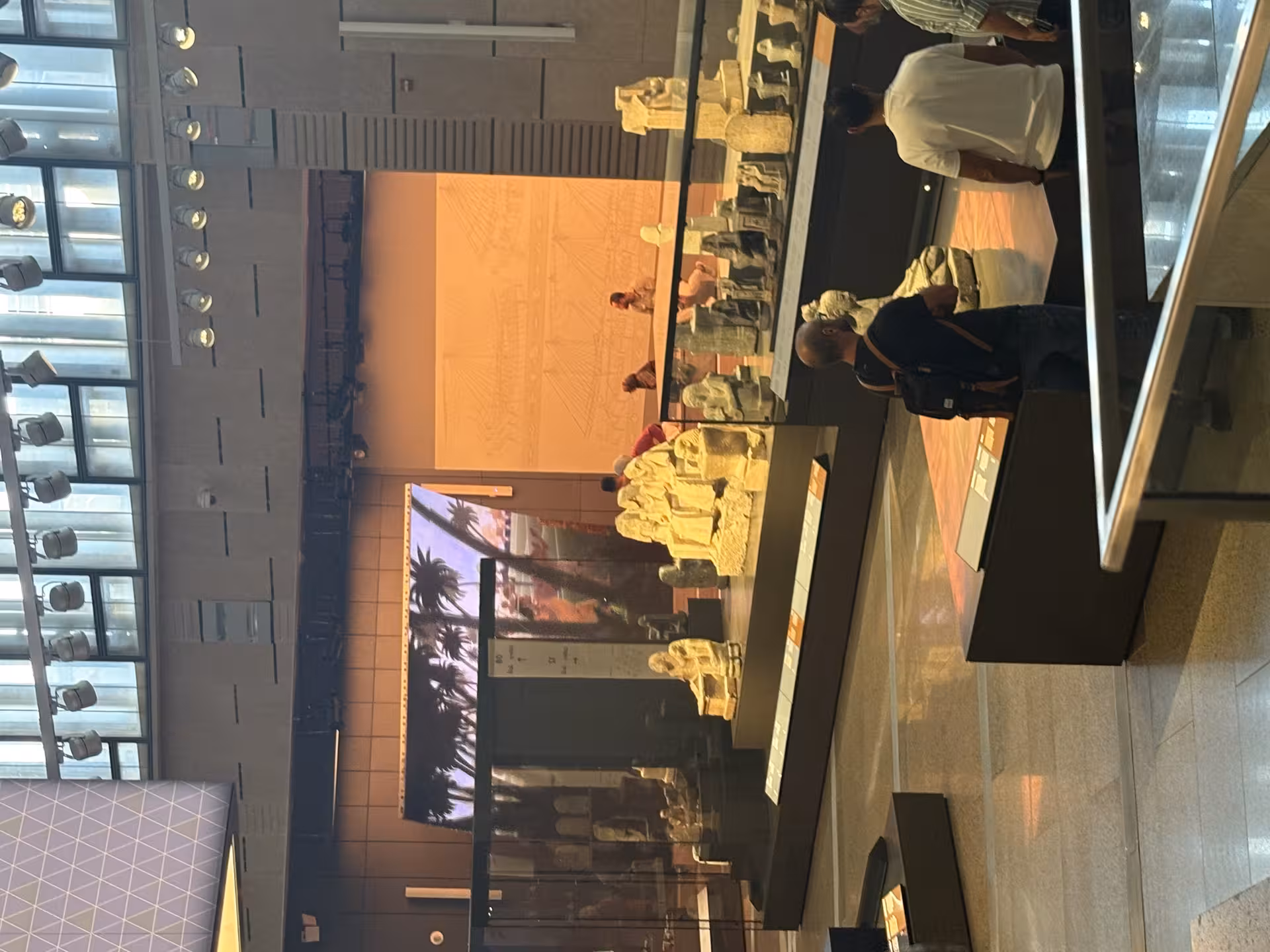 Grand Egyptian Museum gallery with ancient Egyptian statues and displays on a private all-inclusive tour