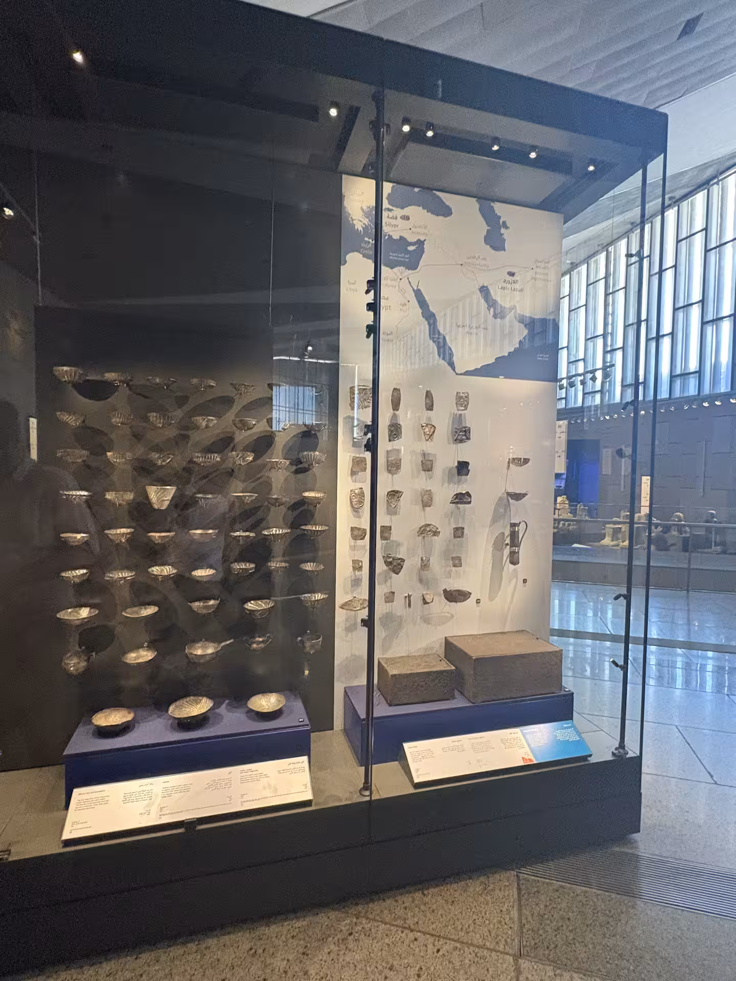 Grand Egyptian Museum gallery display case of ancient Egyptian tools and artifacts on all-inclusive private tour