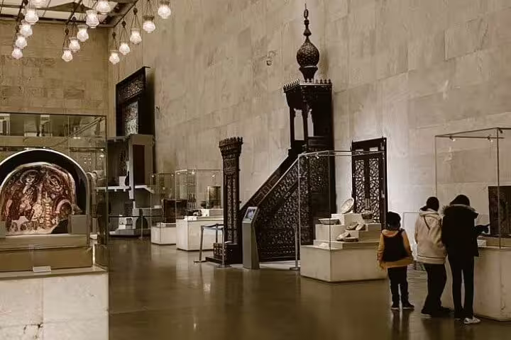 Grand Egyptian Museum gallery in Cairo on Alexandria Port private tour, showcasing Islamic art displays