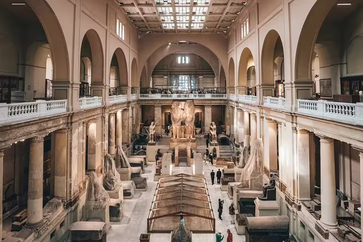 Grand Egyptian Museum gallery with ancient statues and exhibits on Cairo tour from Giza Pyramids