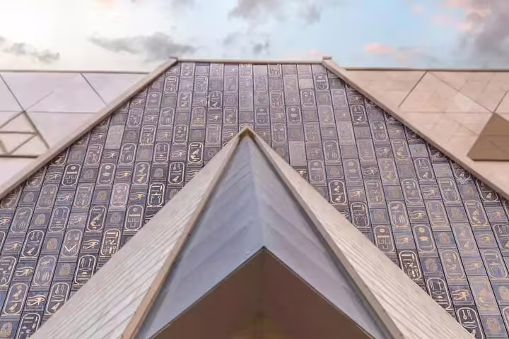 Grand Egyptian Museum entrance facade with hieroglyphic panels, ideal for a private GEM tour in Giza