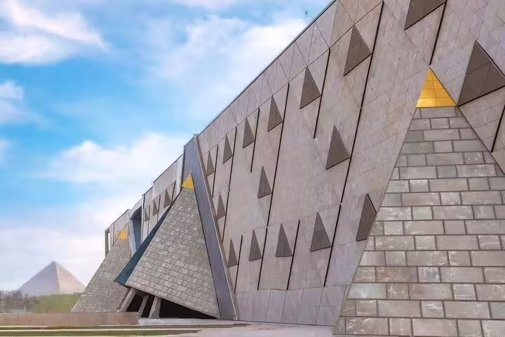 Modern Grand Egyptian Museum exterior near the Giza Pyramids, featured on a private visit to GEM tour