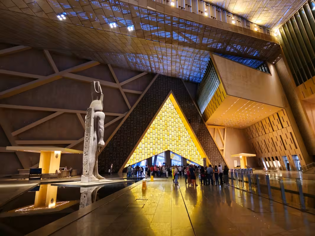 Grand Egyptian Museum interior in Giza with towering statue, included stop on 11-day budget Egypt tour
