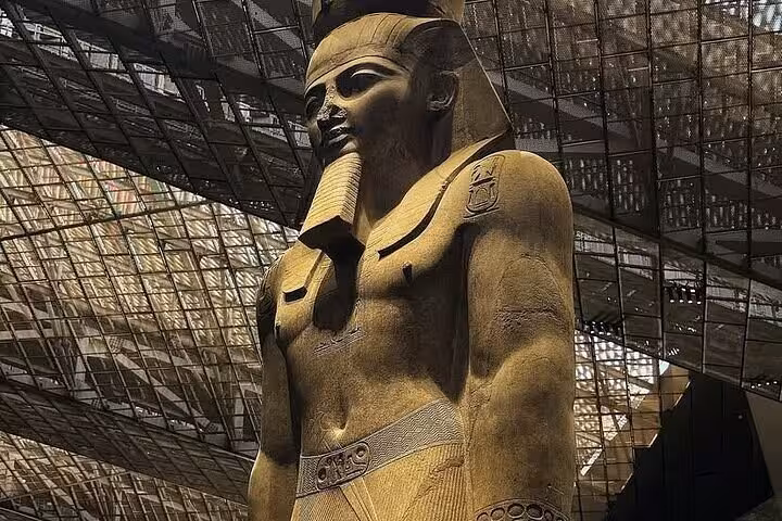 Colossal pharaoh statue inside the Grand Egyptian Museum, highlight of half-day tour with entry tickets