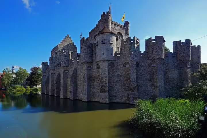 Gravensteen Castle in Ghent reflected in the water, a highlight stop on the e-scavenger hunt city tour