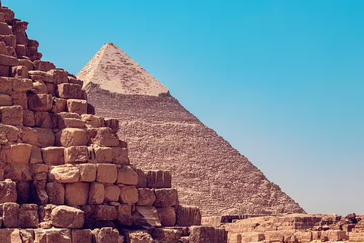 Great Pyramid of Giza viewed from ancient stone blocks, iconic stop on Cairo pyramids, museum and dinner cruise tour
