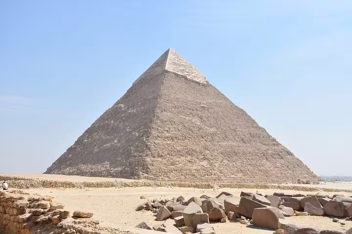 Wide view of the Great Pyramid of Giza under clear sky on a private guided tour with transfers and tickets included