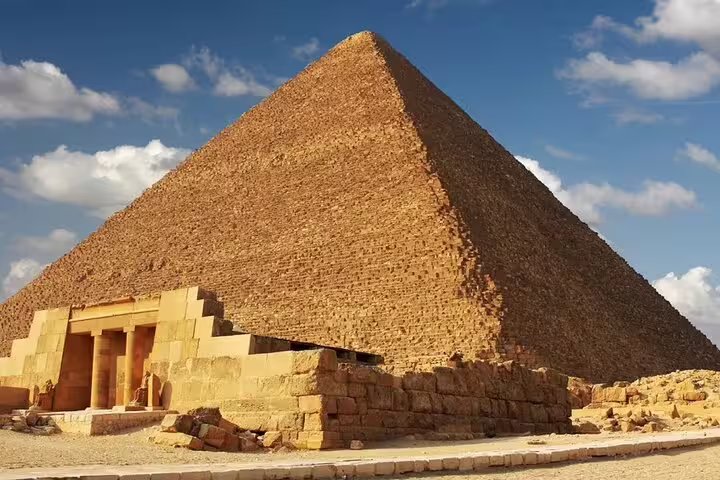 Great Pyramid of Giza close-up under blue sky, highlight stop on private minivan day tour Cairo