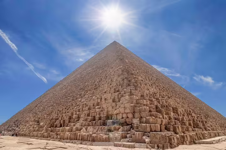 Close-up of the Great Pyramid of Khufu at Giza under bright sun, private guided Cairo pyramids tour stop