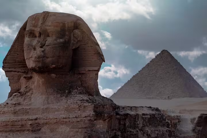 Great Sphinx with Giza Pyramid backdrop, iconic stop on Cairo Pyramids luxury adventure tour