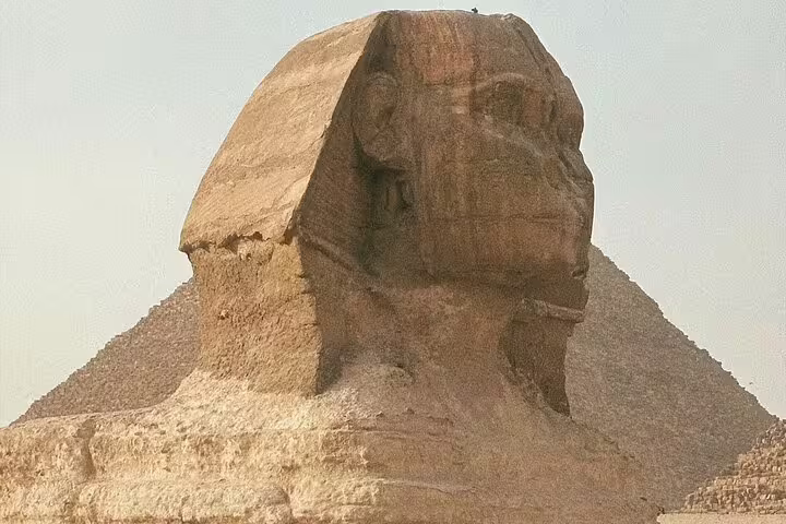 Close-up of the Great Sphinx with Giza Pyramid backdrop on Cairo excursion from Alexandria returning to Port Said