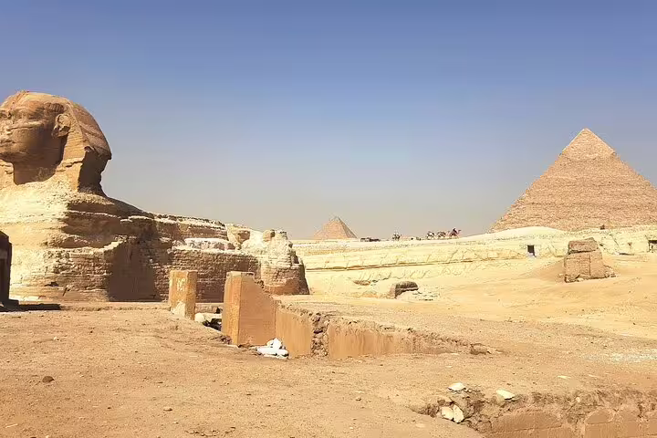 Great Sphinx with Giza Pyramid in background, iconic photo stop on private tour to Giza Pyramids and museum