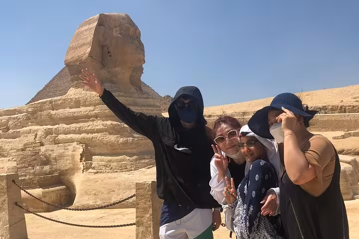 Group photo by the Great Sphinx of Giza, part of inside Great Pyramid, Sphinx and Saqqara Serapeum tour