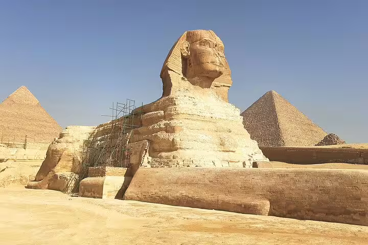 Great Sphinx with Giza Pyramids in background, highlight of private Cairo tour to Memphis and Saqqara