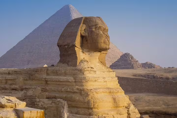 Great Sphinx with Pyramid of Khafre behind it, highlight of private day tour to Giza Pyramids and GEM