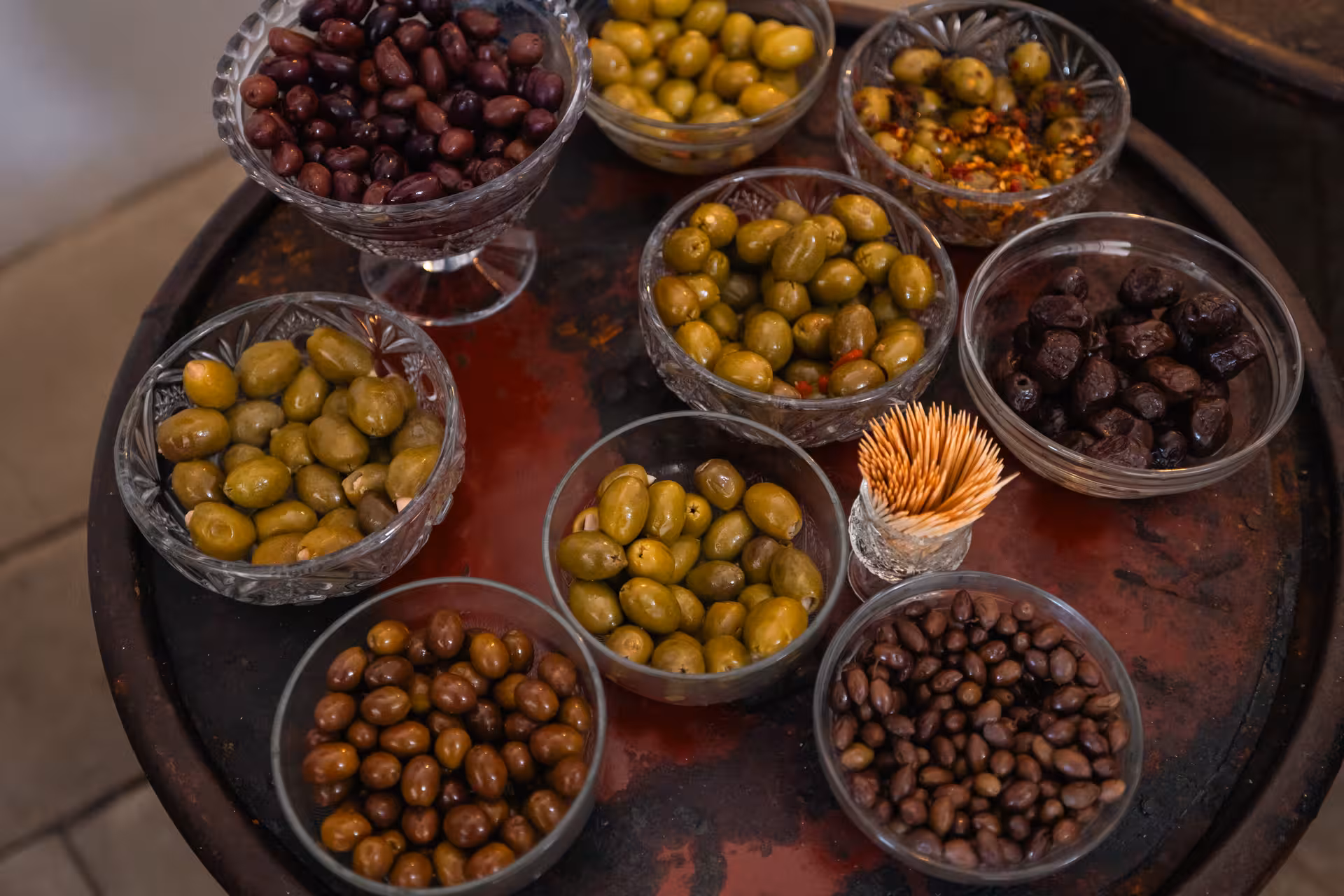 Assorted Greek olives and tapenade bowls for tasting on a Naxos foodie village tour in Greece