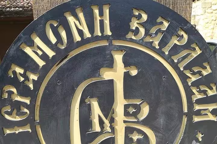 Bronze Greek Orthodox monastery emblem sign, cultural stop on 2-day private Delphi Thermopylae Mycenae tour