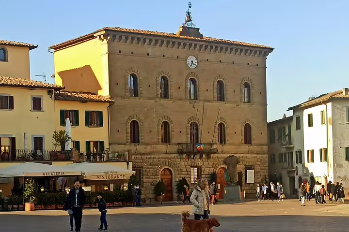 Historic town hall and lively piazza in Greve in Chianti, a classic Tuscan village on a private Chianti wine tasting tour