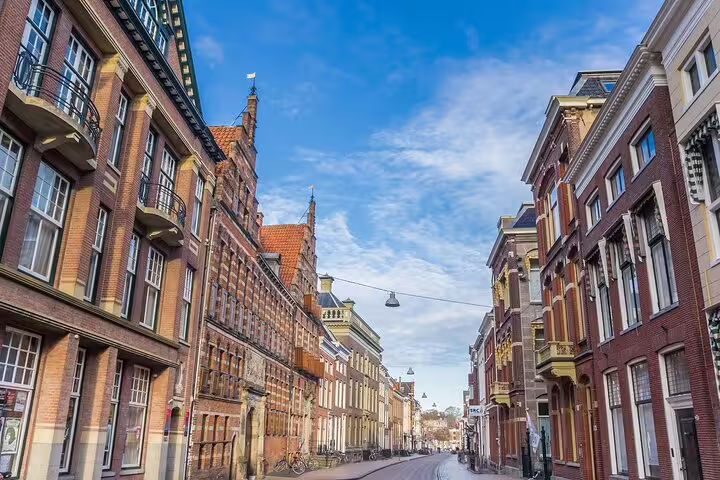 Historic Groningen street with Dutch brick facades, perfect for a self-guided GPS audio walking tour
