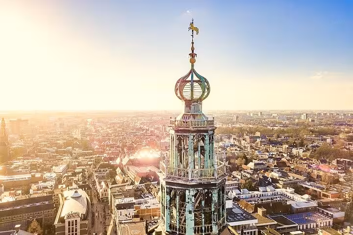 Aerial view of Martinitoren in Groningen at sunset, ideal destination after Amsterdam or Schiphol private transfer