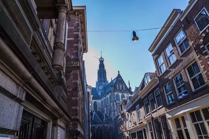 View of Grote Kerk St. Bavokerk from a narrow Haarlem street on a 2-hour private history walking tour