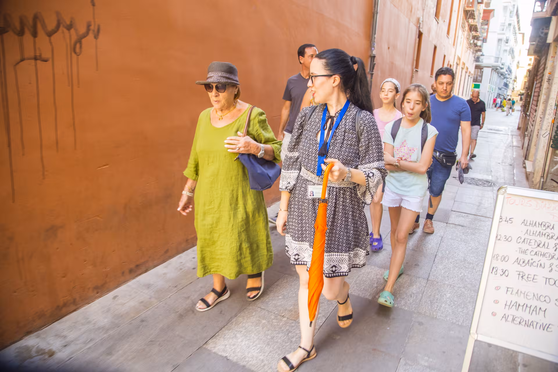 Tour group walking through historic city streets during a guided cathedral tour with admission included.