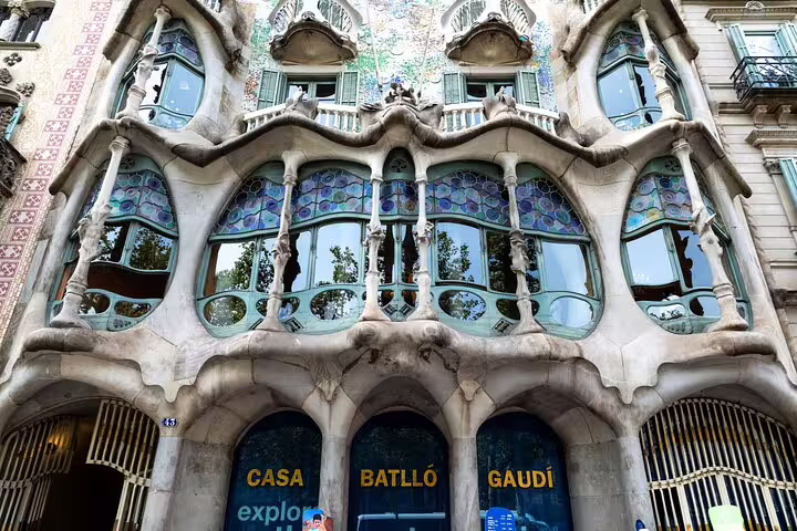Morning view of Casa Batlló façade in Barcelona, showcasing Gaudí’s modernist architecture on a guided La Pedrera tour