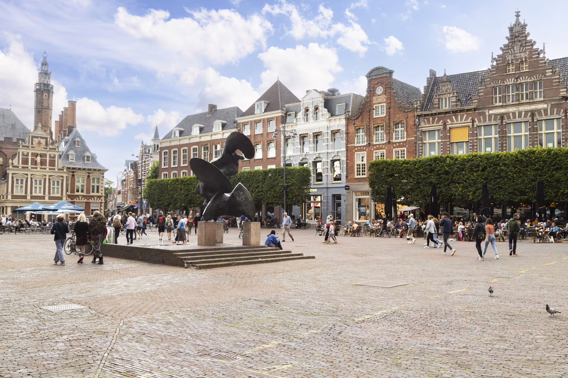Grote Markt Haarlem with modern sculpture and historic facades, self-guided walking tour with audioguide