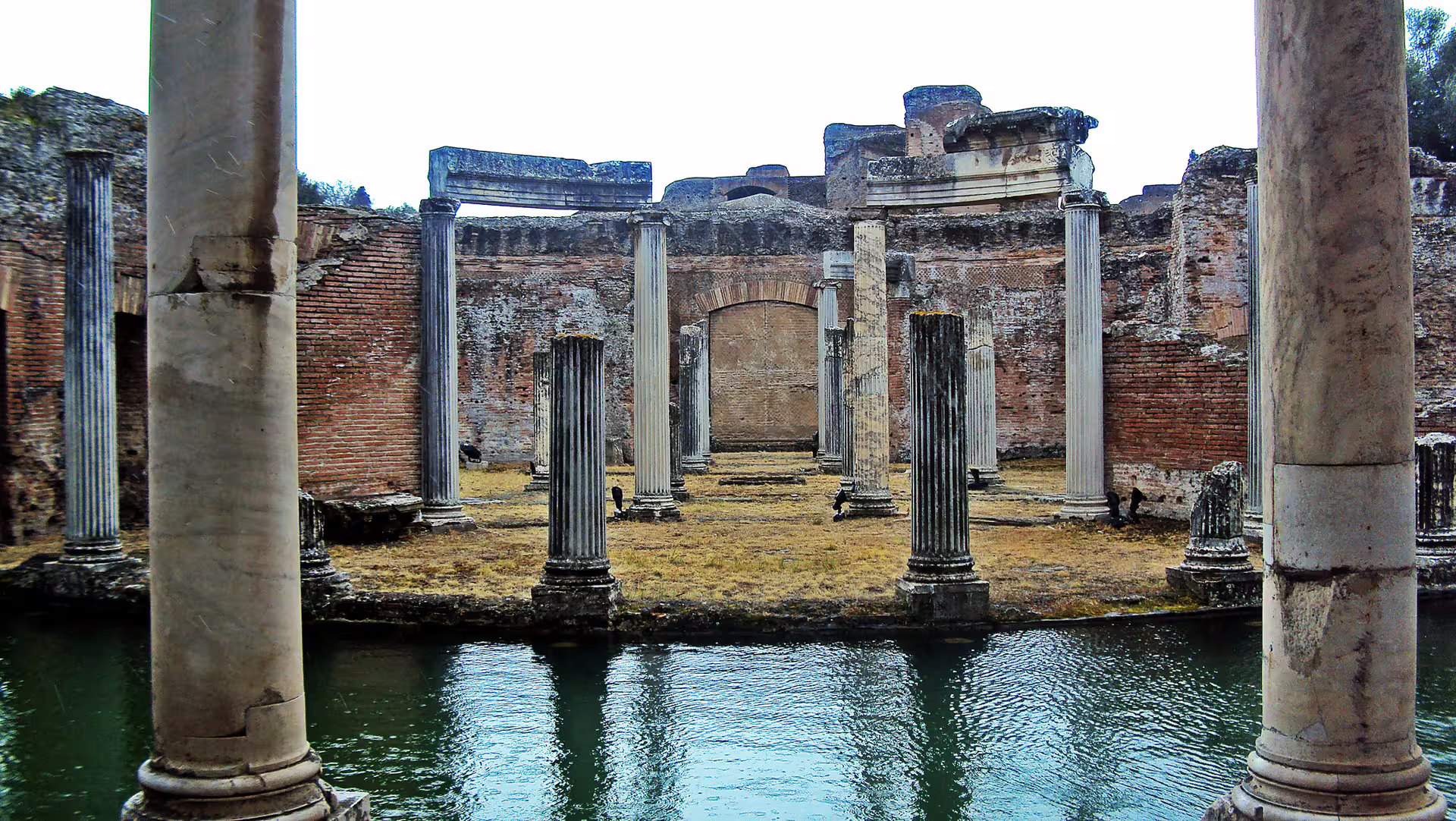 Ancient marble columns and reflecting pool at Hadrian’s Villa in Tivoli, a highlight of small-group tours from Rome