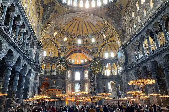 Hagia Sophia interior with grand dome and chandeliers, featured on a private 7-hour Istanbul sightseeing tour