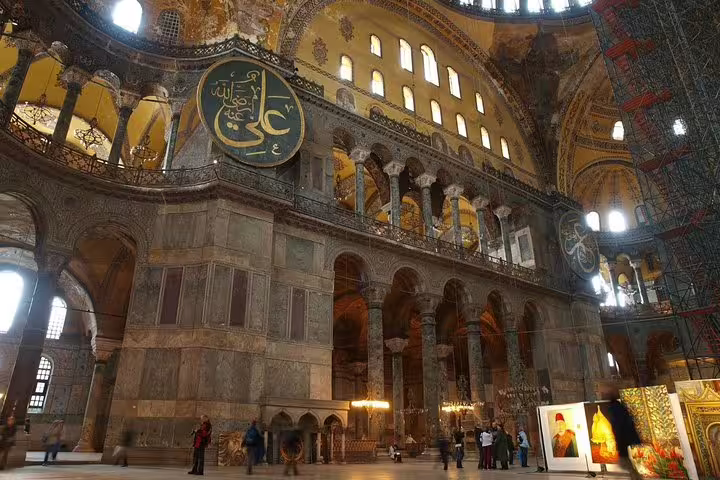 Interior of Hagia Sophia in Istanbul with grand arches and Islamic calligraphy on a private Turkey tour