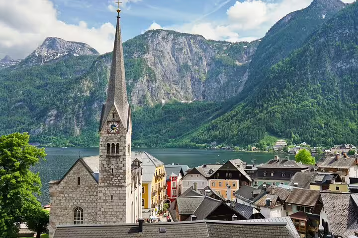 Hallstatt church steeple and lakeside rooftops, key stop on a self-guided scavenger hunt highlights tour