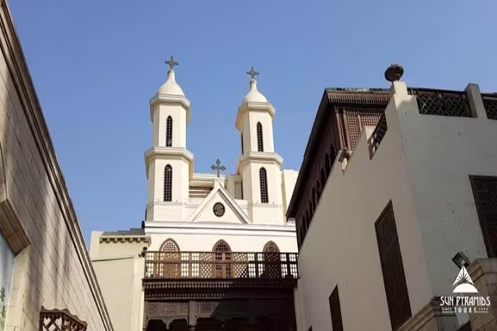 Hanging Church in Old Cairo with twin towers, popular landmark on private Cairo day trip from Hurghada by air