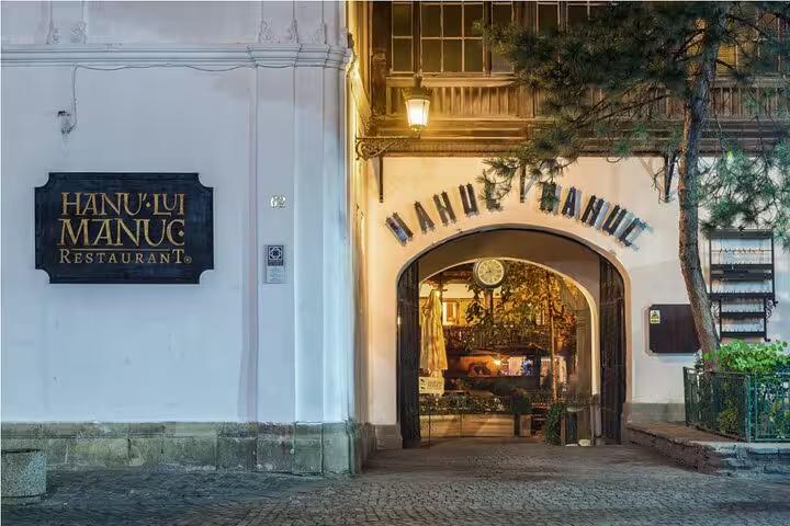 Hanul lui Manuc restaurant entrance in Bucharest Old Town at dusk