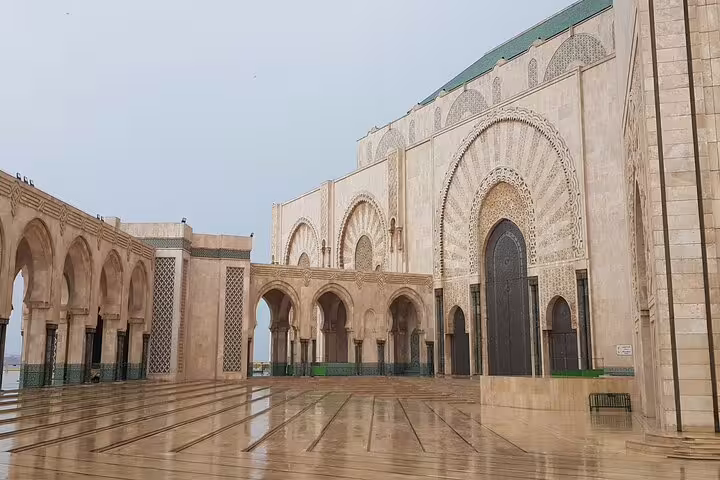 Hassan II Mosque courtyard in Casablanca, ornate arches on Morocco 12-day tour from Marrakech itinerary