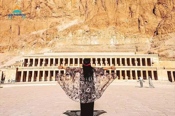 Visitor facing Hatshepsut Temple at Deir el-Bahari, a highlight of the 2-day Cairo and Luxor from Hurghada trip