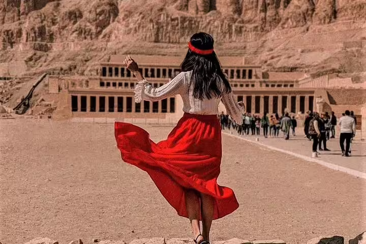Traveler at Hatshepsut Temple, West Bank Luxor on private overnight tour from Cairo by flight, Egypt