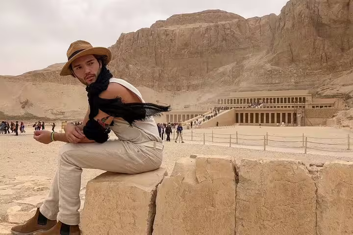 Tourist at Hatshepsut Temple, Luxor on private overnight tour from Cairo by flight with guided sightseeing