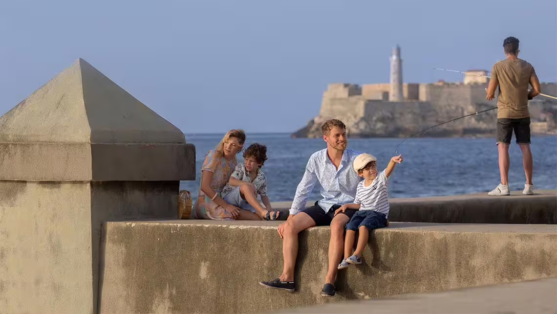 Havana Malecón seawall with families and El Morro fortress views on a 3-hour private guided city tour