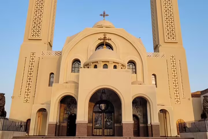 Heavenly Cathedral Sharm El Sheikh exterior on city tour, Coptic church facade with twin towers at sunset