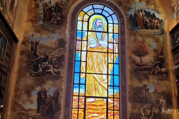 Stained glass and biblical murals inside the Heavenly Cathedral, Sharm El Sheikh city tour cultural stop