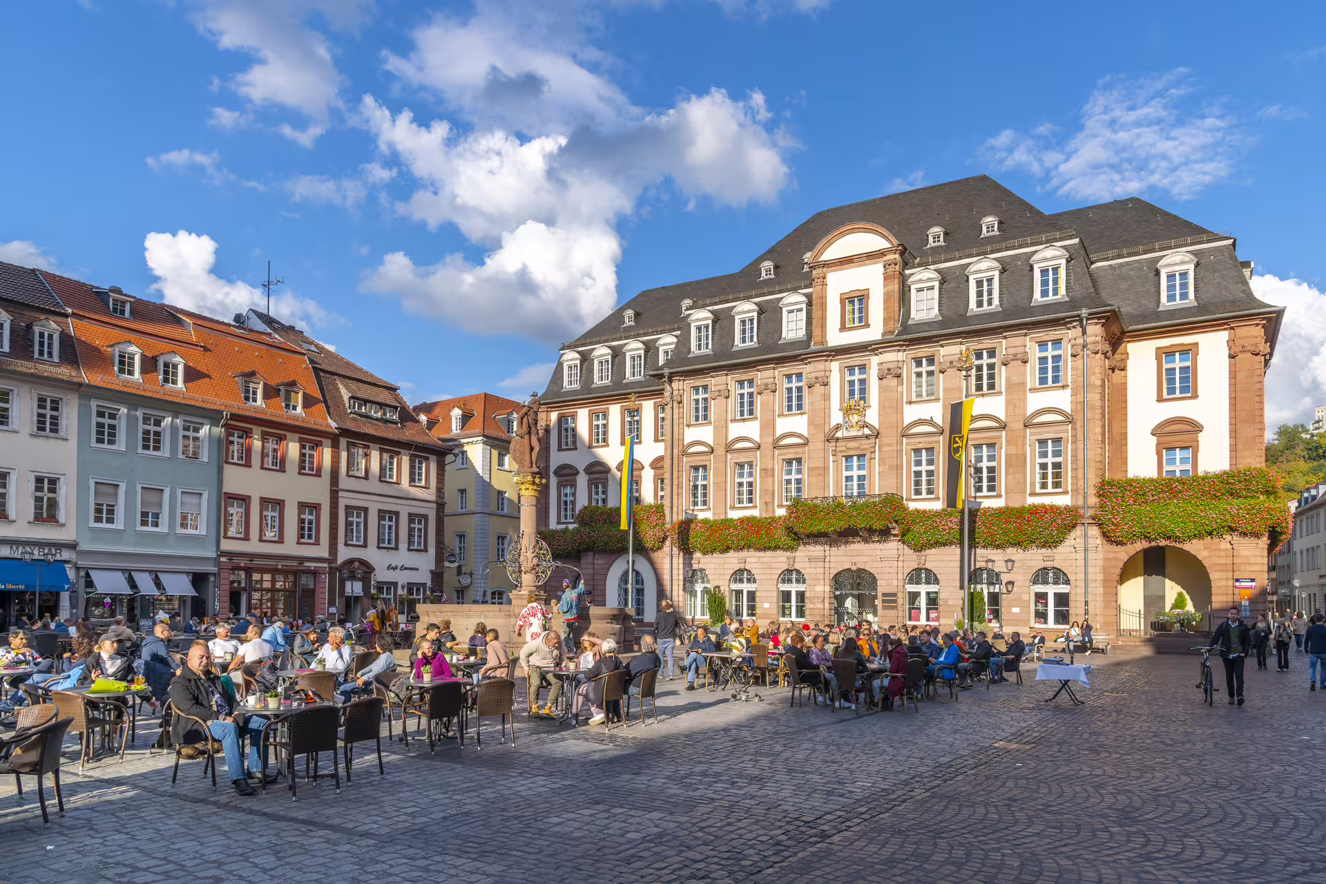 Heidelberg Market Square with Rathaus and café terraces, ideal stop on a 1-day walking tour with audioguide