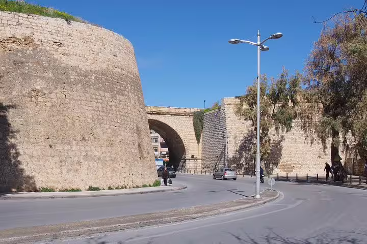 Heraklion city walls and arched gate on panoramic city tour, part of Knossos Palace skip-the-line trip