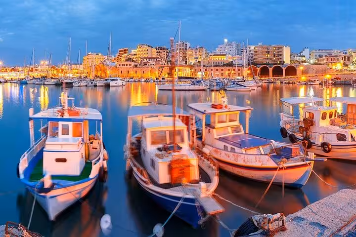 Fishing boats in Heraklion Old Harbor at blue hour, coastal highlight on Knossos and Heraklion day trip