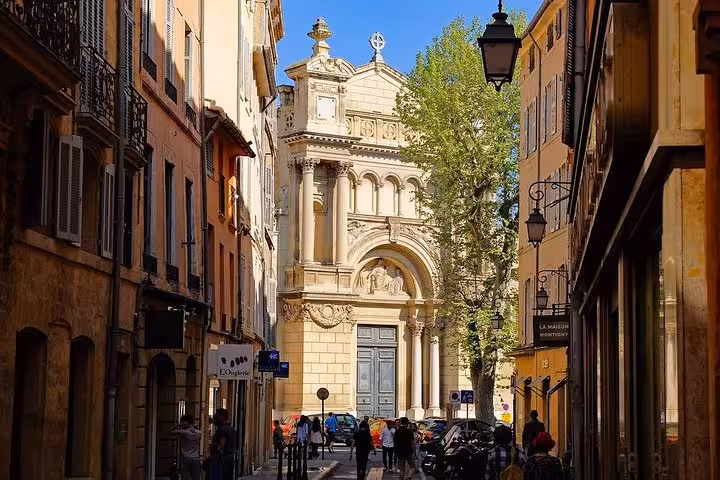 Historic church facade at the end of a narrow old-town street, cultural highlight on a 3-day heritage tour